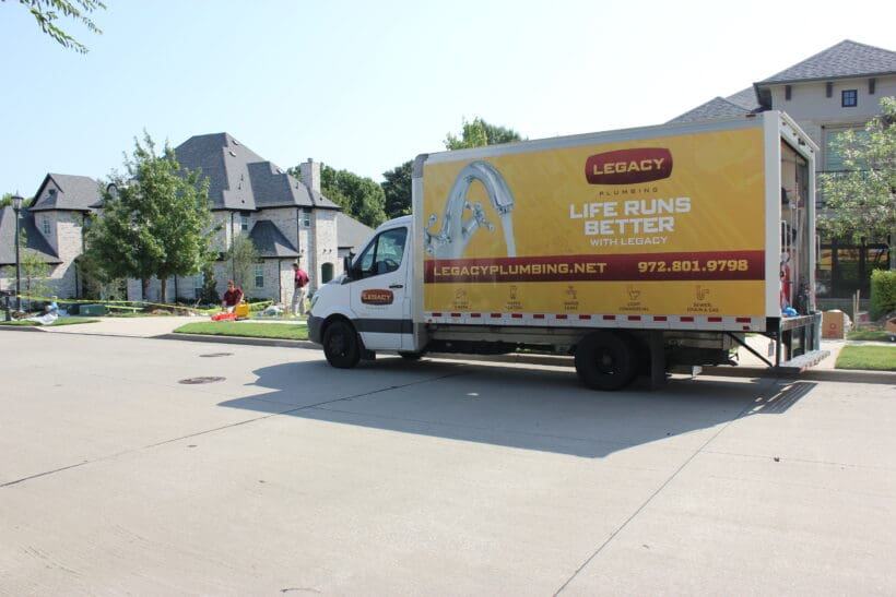 Legacy Plumbing service truck parked outside of a home